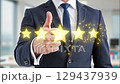 A professional gives a top rating, illustrating positive feedback and high standards of service 129437939