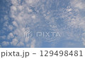 Altocumulus clouds moving in the blue sky - Time lapse 129498481