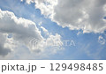 Cottony clouds changing in the blue sky - Time lapse 129498485