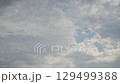 Rain clouds hiding the blue sky - Time lapse 129499388