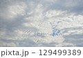 Rain clouds hiding the blue sky - Time lapse 129499389