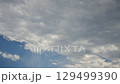 Rain clouds hiding the blue sky - Time lapse 129499390