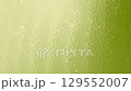 Abstract background featuring olive green hues with a subtle water ripple texture and shimmering light reflections, evoking a calm, organic, and nature-inspired aesthetic suitable for eco-friendly 129552007