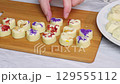The location of the desserts of white chocolate with spray on a wooden board 129555112