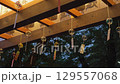 Many wind chimes decorated at the gate of a shrine at night 129557068