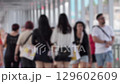 Crowd of Unrecognizable People Walking in Urban Space 129602609