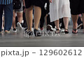 Busy Urban Sidewalk Foot Traffic Close-Up During Daytime 129602612