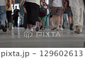 Footsteps of Diverse People Walking in a Busy Urban Environment 129602613