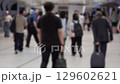 Busy Urban Station with Diverse Crowd Walking in Motion 129602621