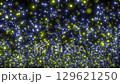 Loop background of slowly rising fine light particles in yellow and blue 129621250