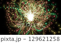 Yellow loop background of light particles that draw an arc and gather in the center 129621258