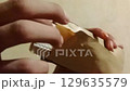 Close-up of Hands Opening Brown Envelope Containing Spoon, Fork, and Tissue in 4K Close-up of Hands Opening Brown Envelope Containing Spoon, Fork, and Tissue in 4K 129635579