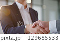 Business People Shaking Hands During a Corporate Partnership Agreement 129685533