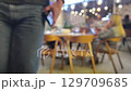 Casual gathering in busy urban cafe with male and female patrons in relaxed 129709685
