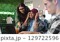 Computer coding, men or women collaboration on laptop or tablet in design startup. Smile, happy people or teamwork website engineer with cyber security code, digital software or technology app office 129722596