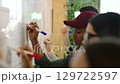 Whiteboard, writing and teamwork planning on schedule, calendar and business marketing strategy. Office men, women or global collaboration in creative workshop with innovation vision for brand growth 129722597