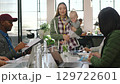 Mom team manager, presentation and business speaker working at a teamwork meeting. Tech startup woman ceo and mother with a baby at work speaking with staff using technology in a strategy seminar 129722601