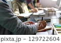 Planning, notebook and paperwork businessman in office and employee for collaboration, teamwork or project management strategy. Workflow manager people and proposal document, portfolio or company KPI 129722604