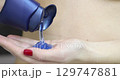 Woman pouring shower gel in bath 4k movie 129747881