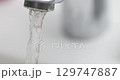 Water flowing from tap in bathroom 4k movie 129747887