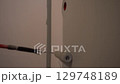 Painting the walls with a roller with pile. Close-up of movement along the wall. Apartment renovation. High quality 4k footage 129748189