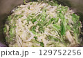 Chopped cabbage boiling in pot for traditional borscht 129752256