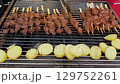 Beef tongue skewers with potatoes grilling on barbecue 129752261