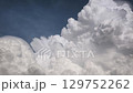 Dramatic cumulus clouds building in summer sky, weather background 129752262
