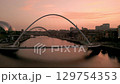 NEWCASTLE/UK 6th SEPTEMBER 2023: Drone tracks around Millennium Bridge Newcastle with Sage Centre and Tyne Bridge in background. Shot in evening twilight  129754353