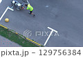 Highway crosswalk working. Applying road markings. Paint a pedestrian crossing with white color. 129756384