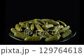 Crunchy pickled cucumbers, bursting with flavor, perfect for sandwiches, salads, or as a tangy snack. 129764618