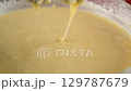 Whisking batter: creating smooth consistency for baking cake biscuit. 129787679