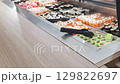 Self service station with rolls and sushi. Food 129822697