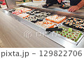 Self service station with rolls and sushi. Food 129822706