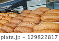 Footage of the various pastry and bread products in the bakery shop 129822817