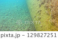 Side view of a large diameter underwater pipeline. 129827251