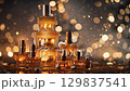 Captivating perfume bottles sparkle against a bokeh background. Happy New Year. Merry Christmas 129837541