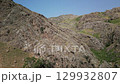 Aerial view of endless Uzbekistan mountain ridges stretching into distant horizons 129932807