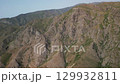 Rugged mountain peaks and sharp ridges, spring greenery in Uzbek landscapes 129932811