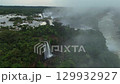 Aerial view of majestic Iguazu Falls cascading during the rainy season 129932927