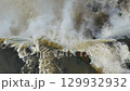 Powerful Iguazu Falls waterfall and mist on the border of Brazil and Argentina 129932932