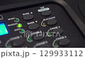 Hand turns off Blackout on lighting console button stops blinking. 4K UHD 129933112