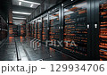 A futuristic data center showcases sleek black server racks lit by vibrant orange lights, creating a captivating atmosphere of advanced technology and efficiency, ideal for automation 129934706