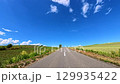 A clear blue sky "Biei Hills" - Running up a gentle slope 129935422