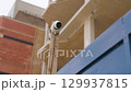 Security camera on construction site with buildings spy concept 129937815