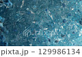 blue crystals slowly rotate in a circle 129986134