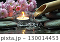 Atmospheric Zen Garden Scene with Water, Stones and Candles 130014453