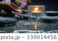 Atmospheric Zen Garden Scene with Water, Stones and Candles 130014456