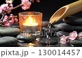Atmospheric Zen Garden Scene with Water, Stones and Candles 130014457