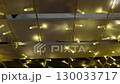 Dynamic ceiling light transition with glowing warm bulbs in modern architecture 130033717